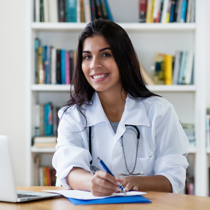 Healthcare provider writing on patient charts