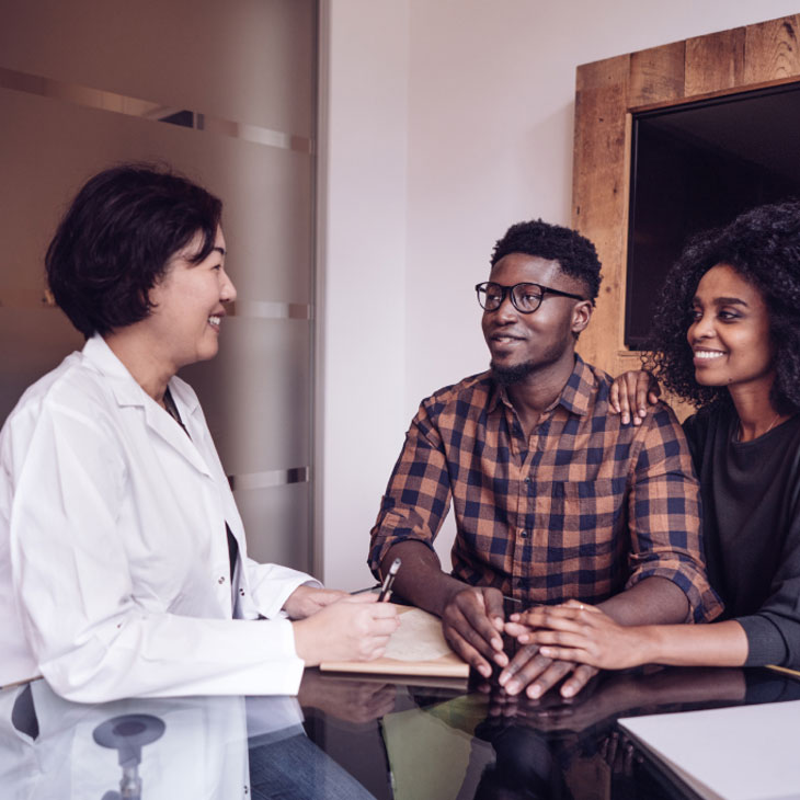 Doctor explaining to young man what testing is needed for male factor infertility