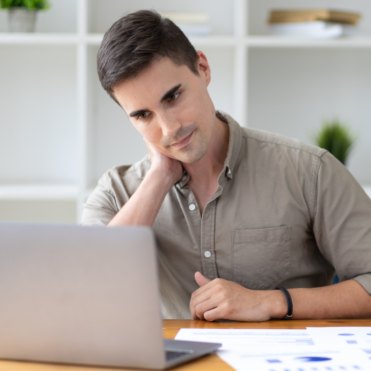 Young man views patient fact sheets on his computer